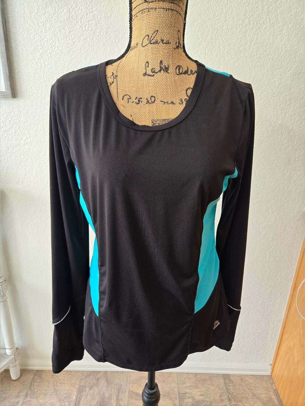 RBX Women’s Black Long-Sleeve Athletic Top with Teal Panels